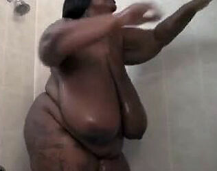 This Enormous ebony dame wanks in the shower. Her yam-sized